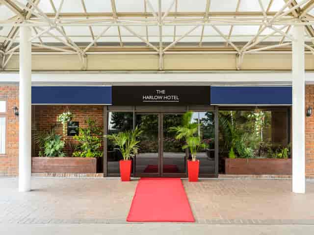 Harlow Hotel entrance with red carpet, ideal for events and meetings.