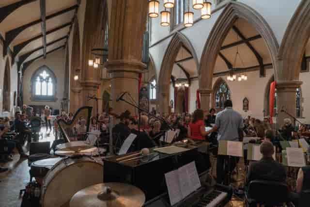 St Matthias Church concert venue with stained glass windows and orchestra setup.