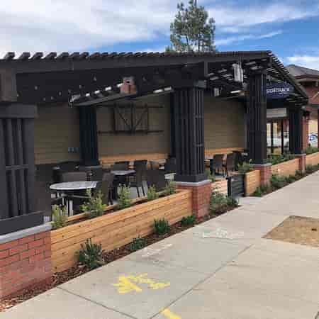 Outdoor seating at SideTrack Bar + Grill, perfect for casual meetings and networking events.