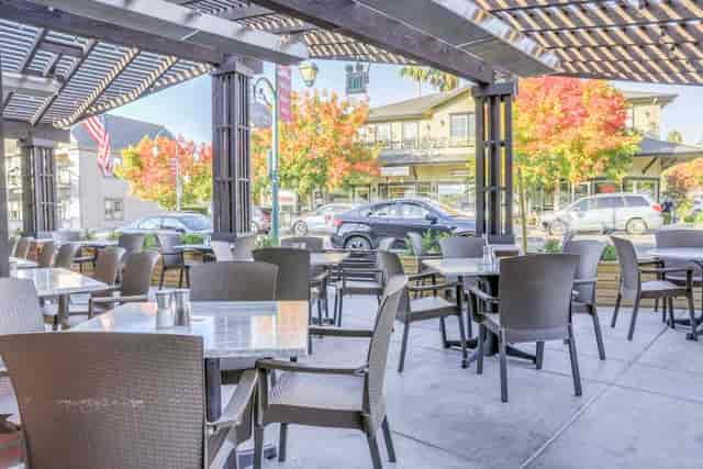 Outdoor dining area at SideTrack Bar + Grill, perfect for casual meetings and networking.