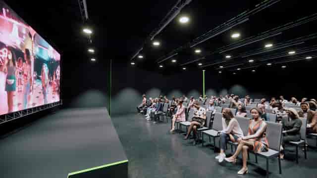 Modern event space with large screen, ideal for conferences and corporate events.