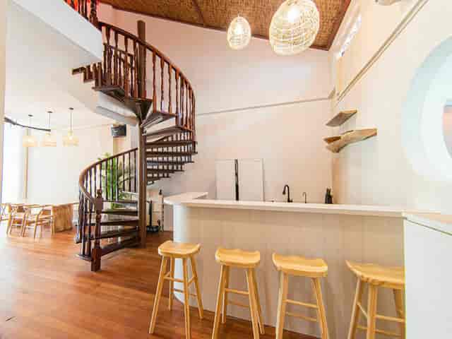 Stylish Norris House venue with spiral staircase, ideal for cocktail receptions and networking.