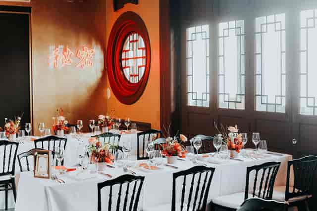 Elegant dining setup with floral centerpieces for corporate dinners and private celebrations.