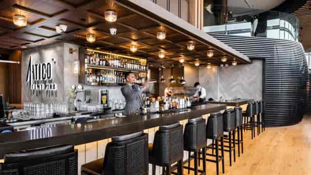 Sleek bar setup with warm lighting for networking events and cocktail receptions.