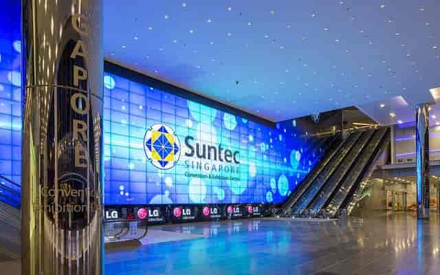 Modern event venue at Suntec Singapore with vibrant digital display for conferences.