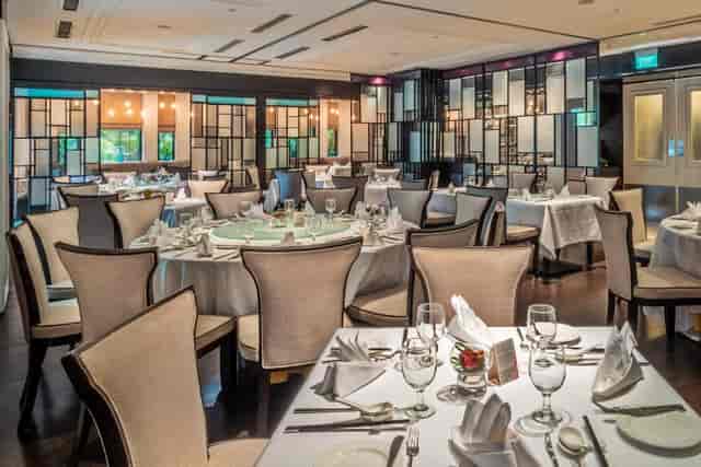 Sophisticated dining setup at The American Club Singapore for corporate events and gatherings.