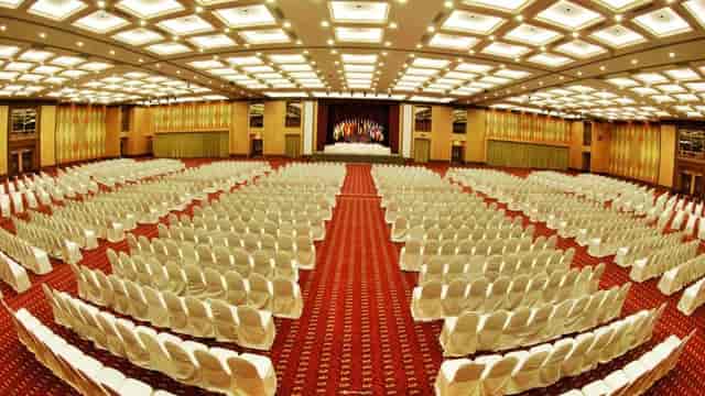 Spacious conference hall with white-covered chairs for events at Persada Johor Convention Centre.