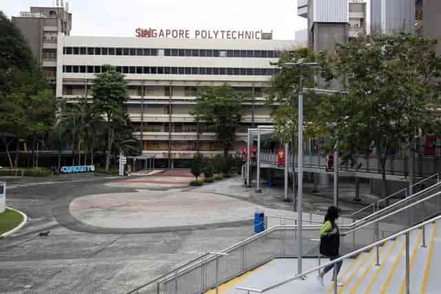 Spacious outdoor event space at Singapore Polytechnic with greenery for gatherings and workshops.