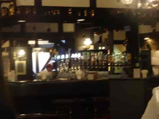 Tavern in Tanglin Club bar with warm lighting, ideal for networking events and gatherings.