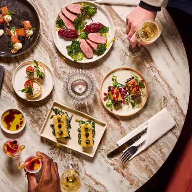 Gourmet dishes in The Ellis Room, London Coliseum for upscale networking events.