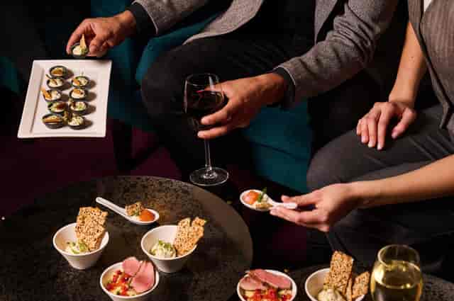 Elegant networking event in The Chairman’s Room, London Coliseum with gourmet sushi.