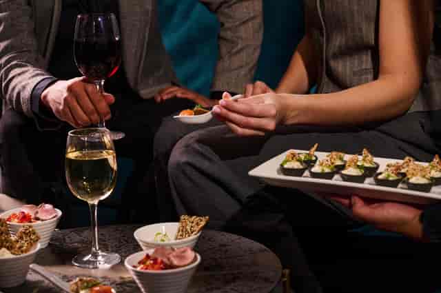 Elegant networking event in The Chairman’s Room, London Coliseum with gourmet hors d'oeuvres.
