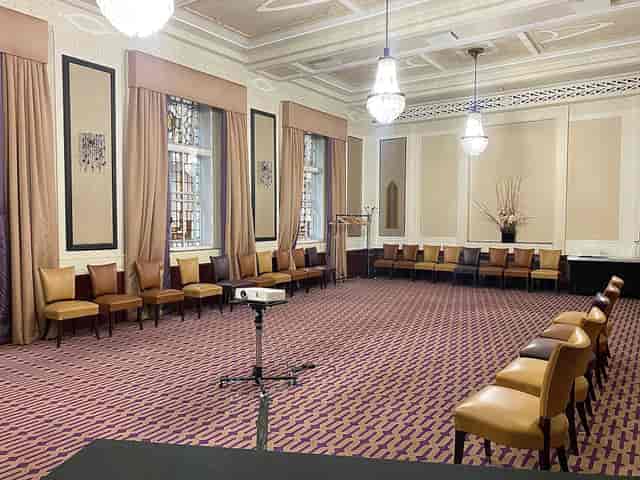 Private dining suite with elegant decor, ideal for professional meetings and workshops.