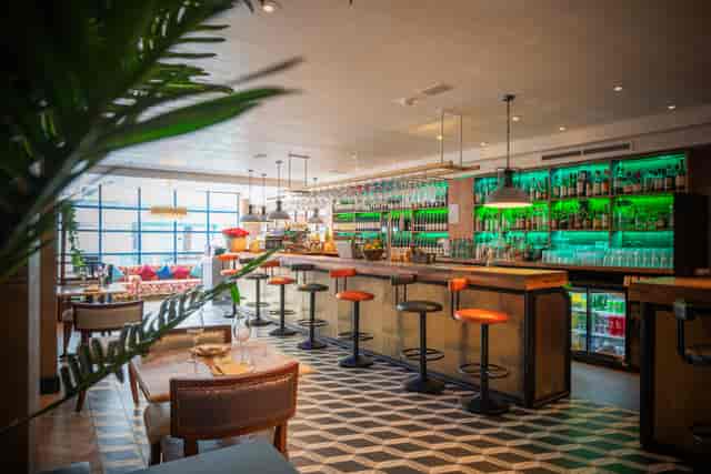 Stylish bar area in Bombay Delight, perfect for networking events and gatherings.