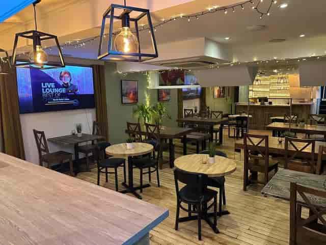 Bar area in Cafe M.A.D., ideal for networking events and meetings. Cozy atmosphere.