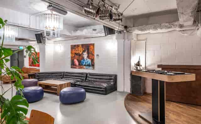 Versatile event space at Pizza East with stylish lounge and DJ setup for gatherings.
