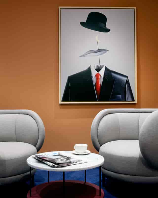 Modern meeting space in art'otel London with minimalist furniture and inspiring artwork.