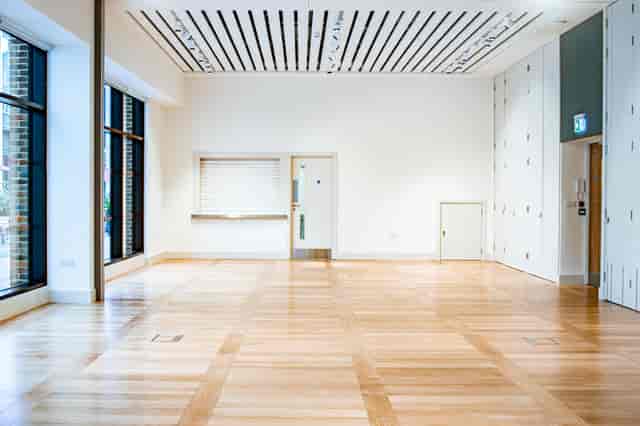 Versatile event space with natural light, ideal for corporate meetings and workshops.