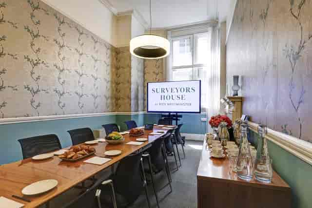 Hong Kong meeting room with wooden table, ideal for professional events and presentations.