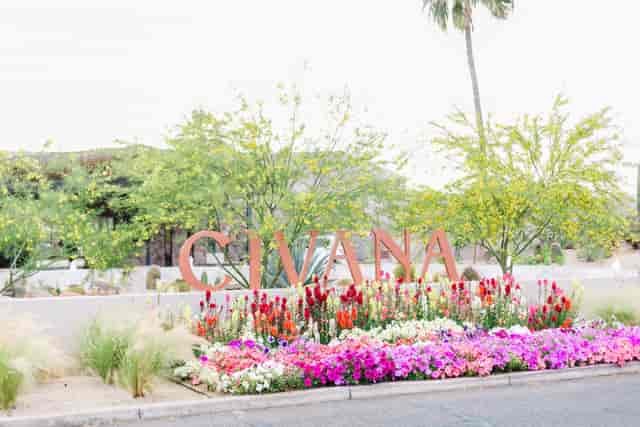 CIVANA Wellness Resort Rose Garden entrance with vibrant flowers, perfect for retreats and events.