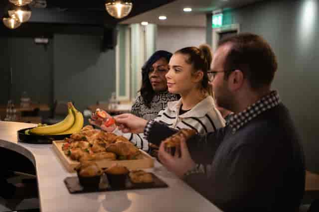 Park Place Event Space refreshment station with pastries and fruit for networking event.