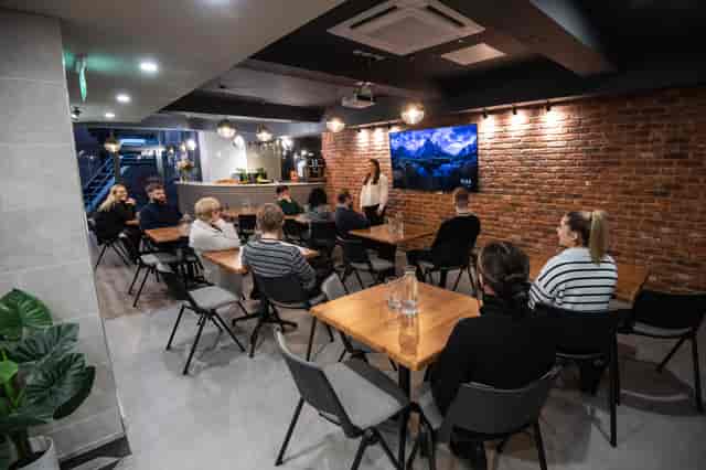 Park Place Event Space with brick wall, ideal for workshops and team meetings.