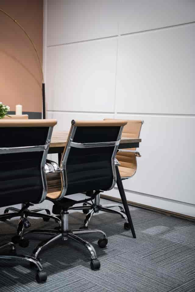 Modern Peach Suite meeting space with stylish chairs, ideal for workshops and executive meetings.