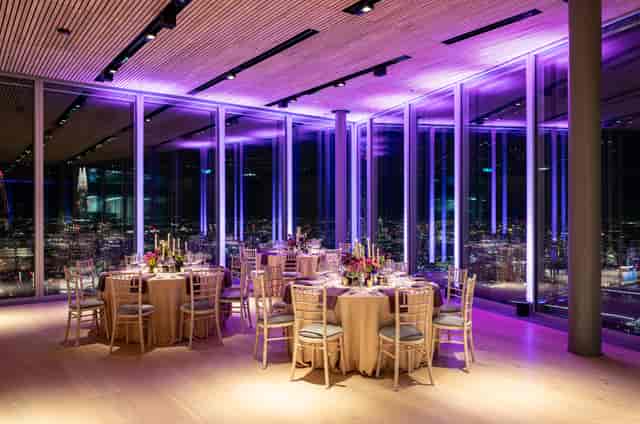 Sophisticated event space at The Lookout, Bishopsgate with floral centerpieces and city views.