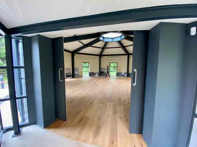 Modern event space with high ceilings at The Retort, ideal for meetings and workshops.