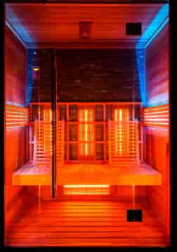 Modern infrared sauna in a wellness space for retreats and corporate health programs.