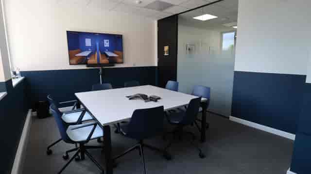 Modern meeting room with ergonomic chairs for collaboration at Common Ground Co Working.