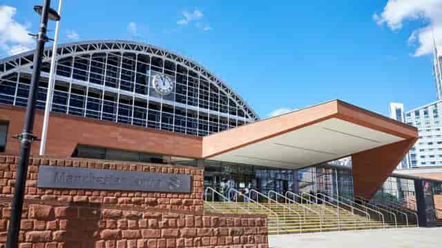 Modern Manchester Central Convention Centre with glass windows, ideal for conferences and events.