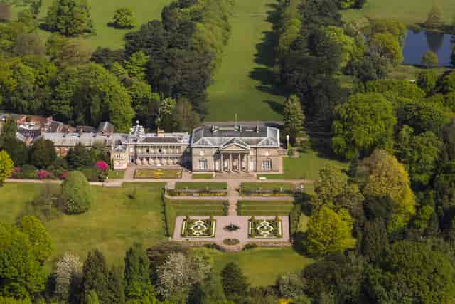 Tatton Park courtyard with elegant architecture, ideal for corporate retreats and weddings.