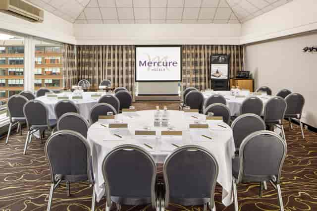 Corporate meeting room with circular table at Mercure Manchester Piccadilly Hotel.