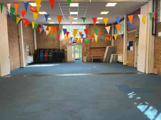 Large Hall in Barnsbury Community Centre with colorful bunting for events and gatherings.