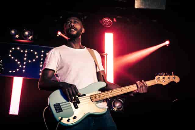Musician performing on stage at The Live Room, Colours Hoxton, vibrant live event atmosphere.