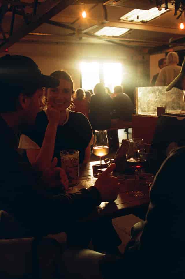 Hackney Wick Hangout at The Cause, warm lighting, networking event for community engagement.