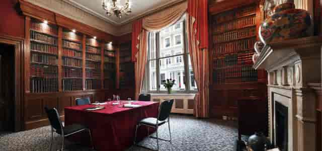 Sophisticated meeting room with wooden paneling at Gem Strathmore Hotel for events.