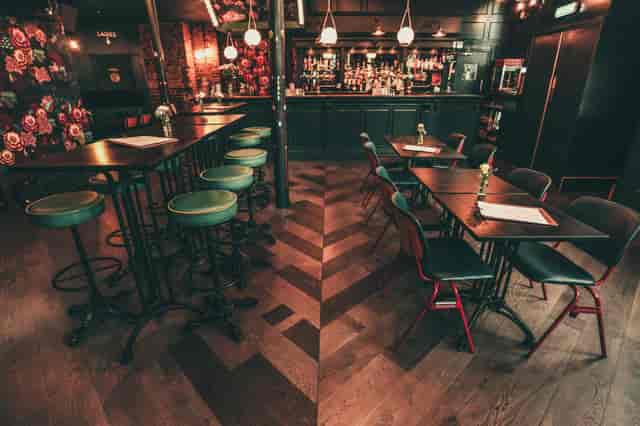 Stylish venue with colorful seating, ideal for networking events and intimate dinners.