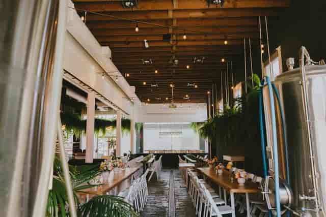 Private event venue with wooden beams, ideal for corporate meetings and social gatherings.