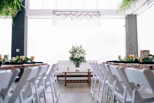 Elegant event space at Kombuchery with floral centerpiece, perfect for gatherings and meetings.