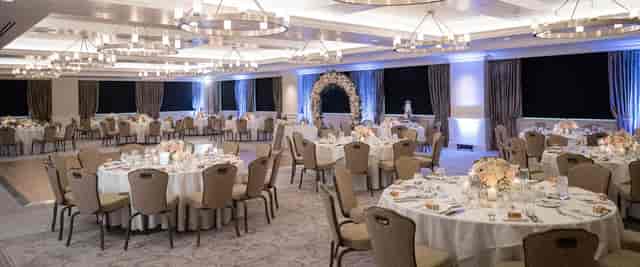 Elegant event space with floral centerpieces for weddings and formal gatherings.