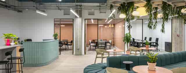 Modern meeting space in Fulham with glass-walled rooms for events and collaboration.