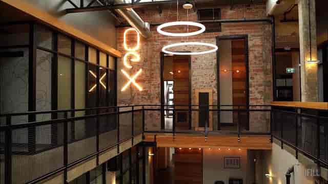 Modern industrial venue with exposed brick, ideal for corporate meetings and creative workshops.