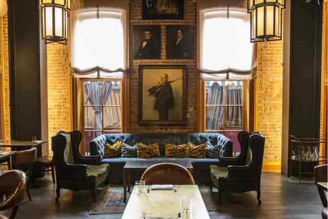 Stylish private lounge with plush seating, perfect for networking events and meetings.
