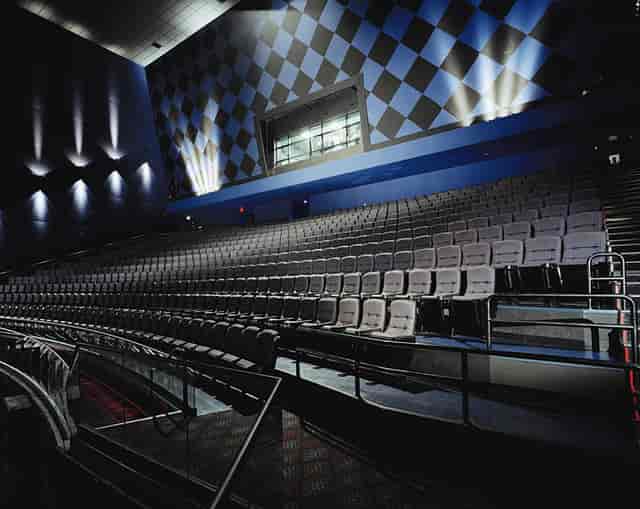 IMAX theater auditorium with tiered seating for conferences and presentations.