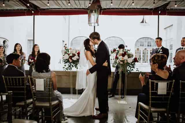 Elegant wedding ceremony at Second Floor Venue, Berkeley City Club with floral arrangements.