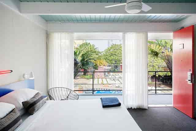Vibrant hotel room with large windows, ideal for meetings and events in Phoenix.
