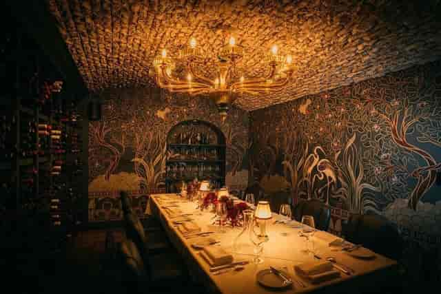 Elegant private dining room with warm lighting for intimate gatherings and corporate events.