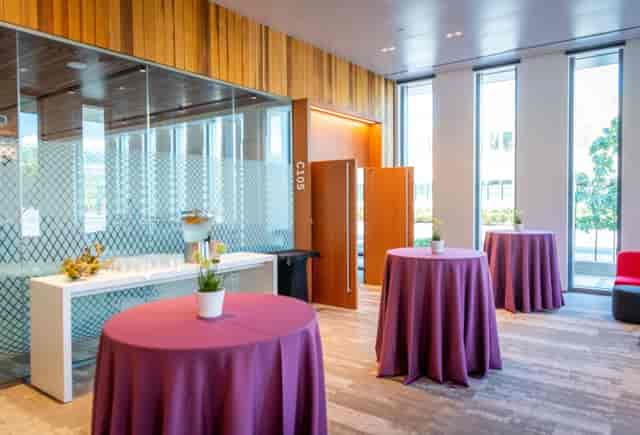 Modern Stanford conference center with round tables, perfect for networking events.